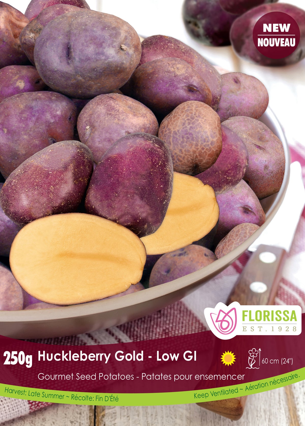 Pomme de terre ‘Huckleberry Gold’ ( Solanum tuberosum ) : des pommes de terre à peau violette avec une coupe montrant la chair jaune. Le visuel Florissa présente la plante et son nom dans la partie inférieure de l’étiquette. La photographie occupe presque toute la surface, tandis que le bandeau du bas rassemble les indications du produit. Cette vue permet de reconnaître son apparence et de distinguer la variété présentée.