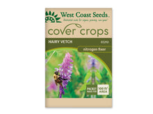 Sachet beige et vert West Coast Seeds de la gamme Cover Crops, portant le nom anglais Hairy Vetch et le code CC212. La photo centrale montre une grappe de fleurs violettes visitée par un bourdon jaune et noir. Un encadré vert et blanc dans le coin inférieur droit annonce une couverture de 100 pieds carrés. Le sachet est présenté sur fond blanc.