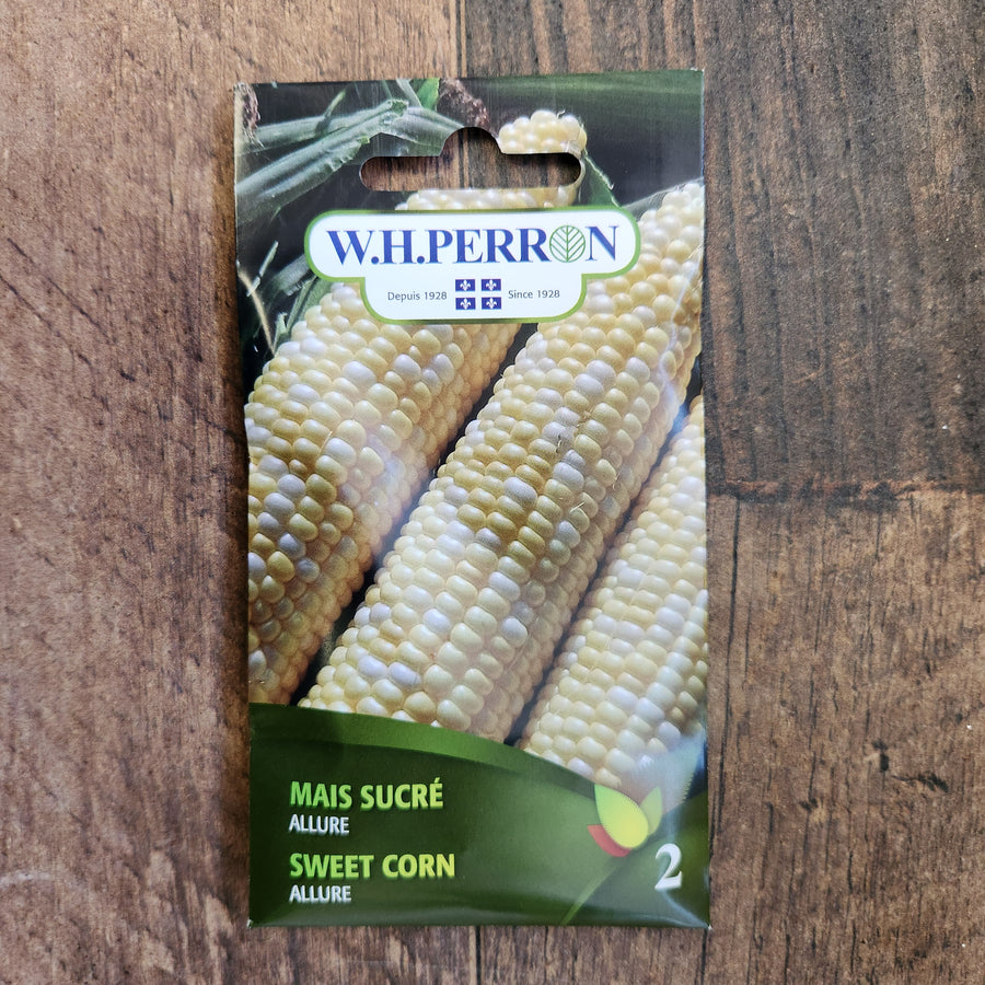Sachet de semences W.H. Perron : Maïs sucré (Zea mays ‘Allure’). L’emballage présente le nom de la sélection et une illustration de la plante ou de la récolte. Cette photographie montre la face avant du sachet, avec les renseignements imprimés visibles et les éléments graphiques qui permettent de reconnaître le produit parmi les autres semences de la gamme.