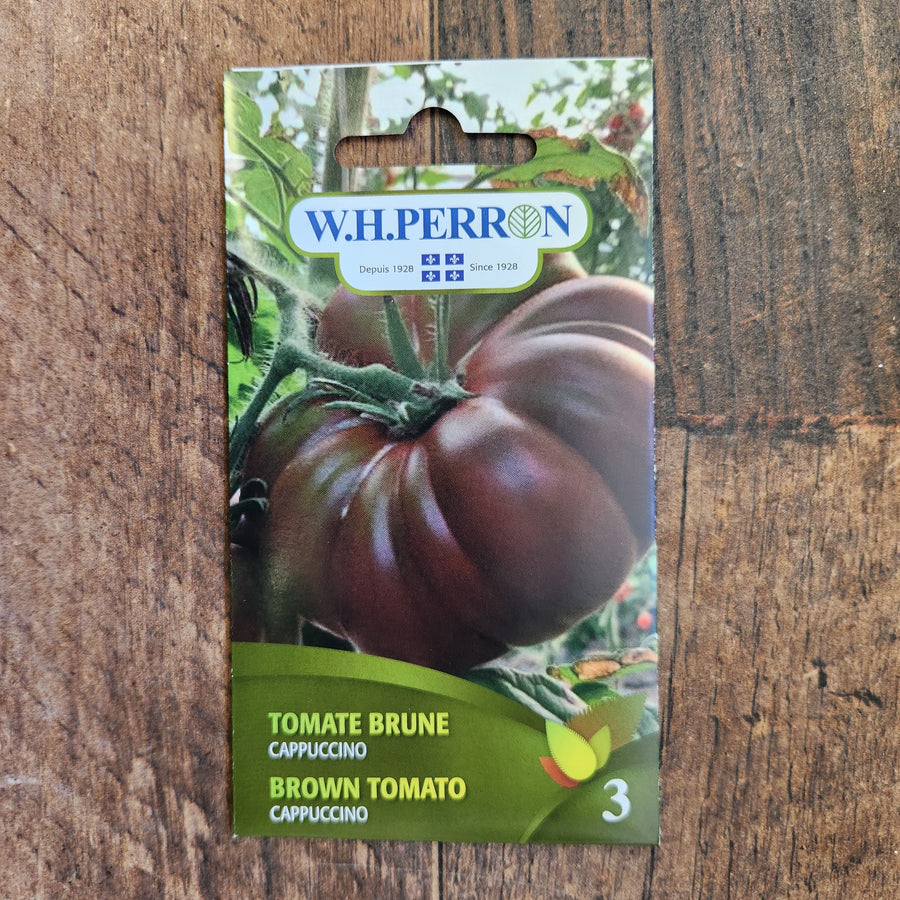 Sachet de semences W.H. Perron : Tomate brune (Solanum lycopersicum ‘Cappuccino’). L’emballage présente le nom de la sélection et une illustration de la plante ou de la récolte. Cette photographie montre la face avant du sachet, avec les renseignements imprimés visibles et les éléments graphiques qui permettent de reconnaître le produit parmi les autres semences de la gamme.