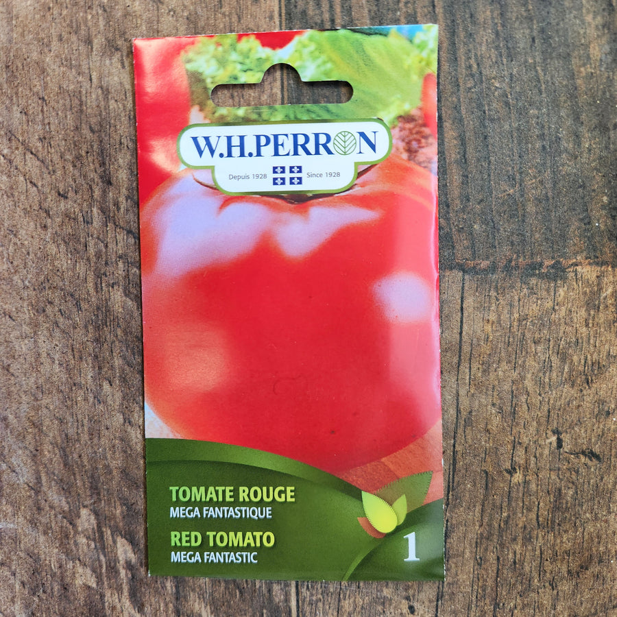 Sachet de semences W.H. Perron : Tomate rouge (Solanum lycopersicum ‘Mega Fantastique’). L’emballage présente le nom de la sélection et une illustration de la plante ou de la récolte. Cette photographie montre la face avant du sachet, avec les renseignements imprimés visibles et les éléments graphiques qui permettent de reconnaître le produit parmi les autres semences de la gamme.