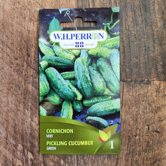 Sachet de semences W. H. Perron : Concombre à cornichon vert (Cucumis sativus). L'emballage présente le nom de la sélection et une illustration de la plante ou de la récolte. Cette photographie montre la face avant du sachet, avec les renseignements imprimés visibles et les éléments graphiques qui permettent de reconnaître le produit parmi les autres semences de la gamme.