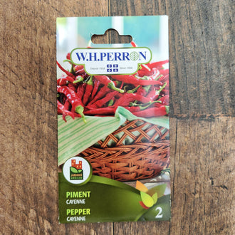 Sachet de semences W. H. Perron : Piment fort (Capsicum annuum 'Cayenne'). L'emballage présente le nom de la sélection et une illustration de la plante ou de la récolte. Cette photographie montre la face avant du sachet, avec les renseignements imprimés visibles et les éléments graphiques qui permettent de reconnaître le produit parmi les autres semences de la gamme.