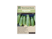 Sachet beige de semences Magda avec un bandeau vert pâle et le nom sur fond brun. La photographie montre plusieurs courgettes courtes, vert très pâle, dressées sur une surface claire devant un fond bleu sombre. Les fruits sont plus larges à leur base et portent des pédoncules verts orientés vers le haut.