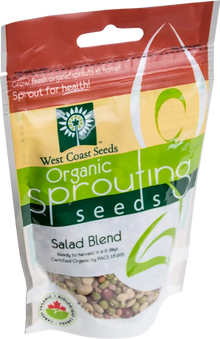 Sachet West Coast Seeds à partie supérieure rouge, avec une étiquette vert jaune portant le nom anglais Salad Blend. La fenêtre transparente laisse voir des graines vertes, rouges et beige, avec des graines plus fines. Le bas blanc de l'emballage présente le logo biologique canadien et les indications de germination. Le délai de 4 à 5 jours est visible sur le devant.