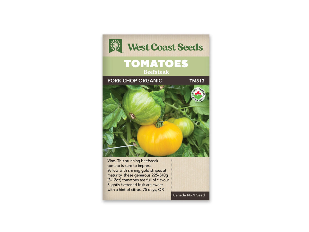 Sachet West Coast Seeds portant les mentions Tomatoes, Beefsteak et Pork Chop Organic. Des tomates jaunes, dont certaines gardent des rayures vertes, sont attachées à des tiges entourées de feuilles vertes. Un logo biologique rond apparaît à droite de la photo. Le nom et le code TM813 figurent sous les bandeaux verts de la marque.