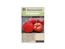 Sachet West Coast Seeds portant les mentions Tomatoes, Main Season et Mortgage Lifter. La photo montre de grosses tomates roses à rouges, dont une est coupée pour révéler une chair dense, sur un fond gris. Un logo biologique rond apparaît à droite. Le nom et le code TM852 figurent sous les bandeaux verts de la marque.