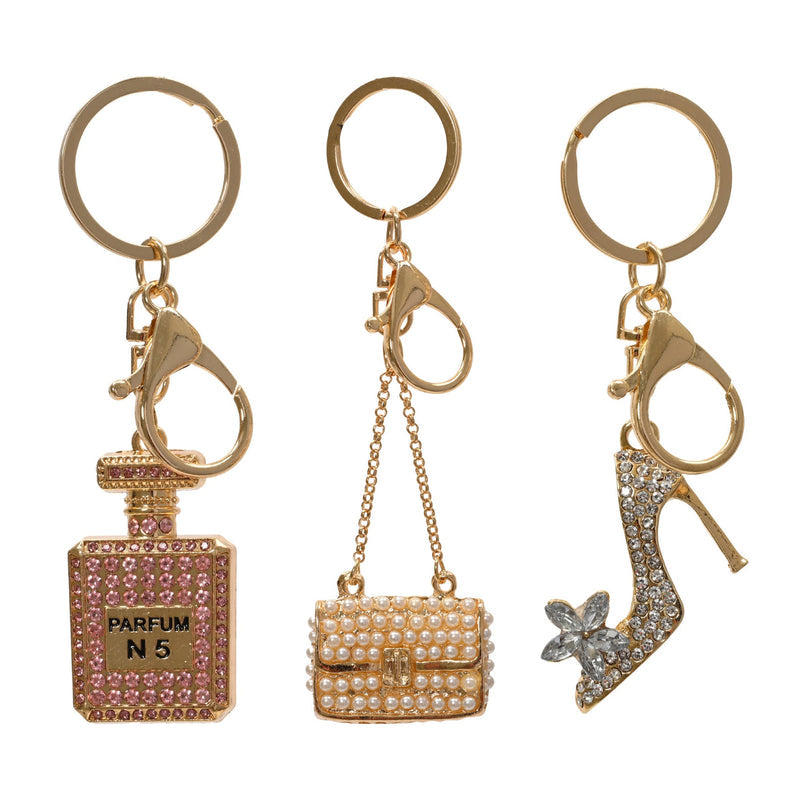 Porte-clés bijou à strass – Doré — Flacon de parfum sur fond blanc
