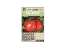 Sachet West Coast Seeds portant les mentions Tomatoes, Early Season et Roadster. La photo montre deux grosses tomates rouges, lisses et brillantes, près de feuilles vertes. Une zone claire se reflète sur le fruit au premier plan. Le nom et le code TM848 figurent sur une bande sombre sous les bandeaux verts de la marque.