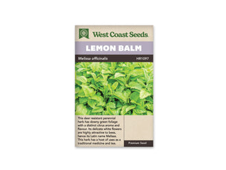 Sachet de mélisse West Coast Seeds présenté de face sur fond blanc. La photographie montre un feuillage vert clair dense, avec des feuilles ovales aux bords dentés et aux nervures visibles. Le bandeau mauve porte le nom LEMON BALM. Le nom Melissa officinalis apparaît sur la bande foncée, au-dessus de la description en anglais.