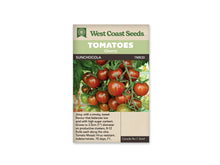 Sachet West Coast Seeds portant les mentions Tomatoes, Cherry et SunChocola. La photo montre un groupe de petites tomates brun rouge, avec quelques fruits plus verts, sur des tiges garnies de feuilles. Des calices verts sont visibles sur les fruits. Le nom figure sur une bande sombre, sous les bandeaux verts de la marque.