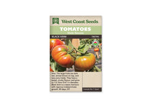 Sachet West Coast Seeds portant les mentions Tomatoes, Main Season et Black Krim. La photo montre des tomates rouge orangé aux épaules vertes, attachées à des tiges parmi des feuilles vertes. Un logo biologique rond apparaît sur le côté droit. Le nom de la variété et le code TM794 sont placés sous les bandeaux verts.